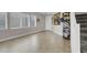 Bright entryway featuring tile flooring, staircase, and an open layout, offering a welcoming first impression at 9840 Chief Sky St, Las Vegas, NV 89178
