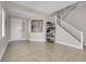 Bright entryway featuring tile flooring, staircase, and an open layout, offering a welcoming first impression at 9840 Chief Sky St, Las Vegas, NV 89178