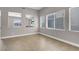 Spacious living room with neutral tones, tile flooring, and bright windows, creating a relaxing atmosphere at 9840 Chief Sky St, Las Vegas, NV 89178