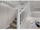 Staircase featuring a classic white railing, seamlessly connecting the home's levels at 9840 Chief Sky St, Las Vegas, NV 89178