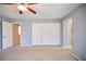 Bedroom featuring a ceiling fan and closet with sliding doors at 10449 Yew Blossom Ave, Las Vegas, NV 89166