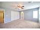Bedroom featuring a ceiling fan, closet with sliding doors, and carpet flooring at 10449 Yew Blossom Ave, Las Vegas, NV 89166