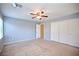 Bedroom featuring ceiling fan and a door for entry at 10449 Yew Blossom Ave, Las Vegas, NV 89166