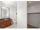Bathroom features a granite vanity top, and a walk-in closet is next to the door at 10748 Steel Ridge Ct, Las Vegas, NV 89135