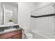 Bathroom features modern tiling in shower and granite vanity sink at 10748 Steel Ridge Ct, Las Vegas, NV 89135