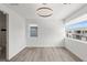 This is a bedroom that features a modern light fixture and a view of the outside at 10748 Steel Ridge Ct, Las Vegas, NV 89135