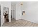 Bright bedroom with light hardwood floors, white walls and modern lighting at 10748 Steel Ridge Ct, Las Vegas, NV 89135