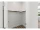 Walk-in closet featuring minimal design with white walls, wood floors, and clothing rack at 10748 Steel Ridge Ct, Las Vegas, NV 89135