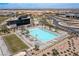 Resort-style community pool with lounge chairs and well-maintained landscaping, offering residents a luxurious oasis at 10748 Steel Ridge Ct, Las Vegas, NV 89135