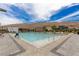 Inviting community pool with ample seating and stunning mountain views, perfect for relaxation and socializing at 10748 Steel Ridge Ct, Las Vegas, NV 89135