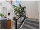 Elegant entryway with a staircase, stone wall, and artistic accents at 10748 Steel Ridge Ct, Las Vegas, NV 89135