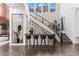 Bright entryway with a modern bar, staircase, fireplace, and luxurious decor at 10748 Steel Ridge Ct, Las Vegas, NV 89135