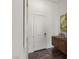 Clean entryway with brown accent furniture and white walls at 10748 Steel Ridge Ct, Las Vegas, NV 89135