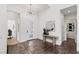 Welcoming entryway features modern lighting and console table at 10748 Steel Ridge Ct, Las Vegas, NV 89135