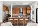 Modern kitchen with stainless steel appliances, large center island, and bar stool seating at 10748 Steel Ridge Ct, Las Vegas, NV 89135