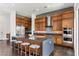 Beautiful kitchen with stainless steel appliances, a large island, and stylish seating at 10748 Steel Ridge Ct, Las Vegas, NV 89135