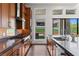 Well-equipped kitchen featuring stainless steel appliances, granite countertops, and ample cabinet space at 10748 Steel Ridge Ct, Las Vegas, NV 89135
