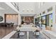 Open-concept living space with modern decor, high ceilings, and a seamless flow to the kitchen at 10748 Steel Ridge Ct, Las Vegas, NV 89135