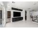 Bright living room boasts a modern entertainment center and lots of natural light at 10748 Steel Ridge Ct, Las Vegas, NV 89135