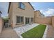 Backyard with brick pavers, low maintenance gravel, and artificial turf at 10974 Cheshire Woods Ave, Las Vegas, NV 89166