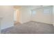 Spacious bedroom with neutral carpet, ample natural light, and neutral walls at 10974 Cheshire Woods Ave, Las Vegas, NV 89166