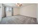 Bedroom featuring neutral carpet and contemporary ceiling fan at 10974 Cheshire Woods Ave, Las Vegas, NV 89166