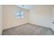 Bedroom with carpeted floors and a sunny window at 10974 Cheshire Woods Ave, Las Vegas, NV 89166