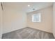 Carpeted bedroom with natural light and a closet at 10974 Cheshire Woods Ave, Las Vegas, NV 89166