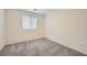Bedroom with wall-to-wall carpet and window at 10974 Cheshire Woods Ave, Las Vegas, NV 89166