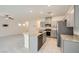 Modern kitchen with stainless steel appliances, granite countertops, and an island with a sink at 10974 Cheshire Woods Ave, Las Vegas, NV 89166