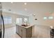 Bright, open kitchen with a large island and stainless steel appliances at 10974 Cheshire Woods Ave, Las Vegas, NV 89166