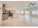 Spacious kitchen featuring stainless steel appliances, an island with granite countertops, and modern cabinetry at 10974 Cheshire Woods Ave, Las Vegas, NV 89166
