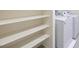 Convenient laundry area includes shelving and new washer and dryer at 10974 Cheshire Woods Ave, Las Vegas, NV 89166