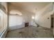 Spacious living room with a fireplace, a vaulted ceiling and access to the staircase at 1436 Padre Bay Dr, Las Vegas, NV 89108