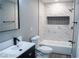 Bathroom featuring marble tile, matte black hardware and a black vanity at 1440 Vegas Valley Dr # 3, Las Vegas, NV 89169