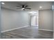 Bedroom with gray walls, a sliding glass door to the patio, base molding, and gray wood-look floors at 1440 Vegas Valley Dr # 3, Las Vegas, NV 89169