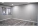 Bright bedroom with gray walls and wood-look floors at 1440 Vegas Valley Dr # 3, Las Vegas, NV 89169