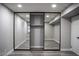 Spacious closet with mirrors, gray walls, base molding, and gray wood-look floors at 1440 Vegas Valley Dr # 3, Las Vegas, NV 89169