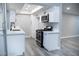 Well-lit kitchen with white cabinets and stainless steel appliances at 1440 Vegas Valley Dr # 3, Las Vegas, NV 89169