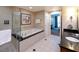Bathroom featuring a soaking tub, glass shower, and vanity at 145 E Harmon Ave # 1120, Las Vegas, NV 89109