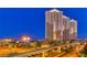 Modern high-rise condo buildings at dusk with palm trees, and the monorail in Las Vegas at 145 E Harmon Ave # 1120, Las Vegas, NV 89109