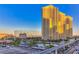 Modern high-rise condo buildings at dawn with palm trees, and the monorail in Las Vegas at 145 E Harmon Ave # 1120, Las Vegas, NV 89109