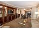 Comfortable living room with a TV, dining table, and a view to the kitchen at 145 E Harmon Ave # 1120, Las Vegas, NV 89109