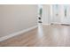 Bright and open entryway featuring sleek laminate flooring, white trim, and a welcoming atmosphere for guests and residents at 1500 E Laguna St, Pahrump, NV 89048