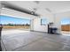 Open garage with a high ceiling, providing ample space and outside view at 1500 E Laguna St, Pahrump, NV 89048