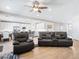 Open-concept living room flows into the kitchen with hardwood floors and comfortable leather seating at 1500 E Laguna St, Pahrump, NV 89048