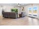 Open-concept living room flows into the kitchen with hardwood floors and comfortable leather seating at 1500 E Laguna St, Pahrump, NV 89048