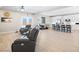 Open-concept living room flows into the kitchen with hardwood floors and comfortable leather seating at 1500 E Laguna St, Pahrump, NV 89048