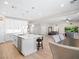 Bright, open-concept space featuring a modern kitchen with a large island and a comfortable living area at 1500 E Laguna St, Pahrump, NV 89048