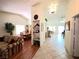 Spacious living room with open floor plan, featuring hardwood and tile flooring at 1536 Brocado Ln, Las Vegas, NV 89117